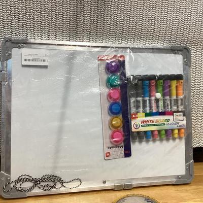 small whiteboard set with magnets and markers