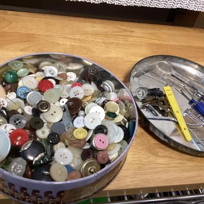 tin full of buttons and a few misc. sewing items