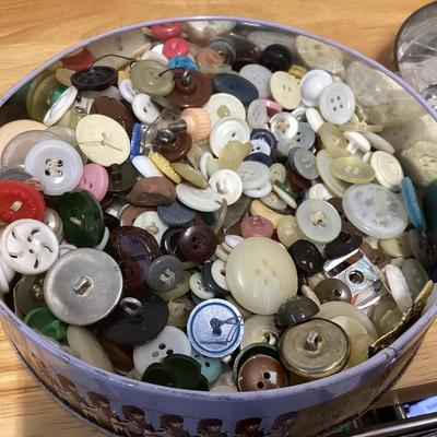 tin full of buttons and a few misc. sewing items
