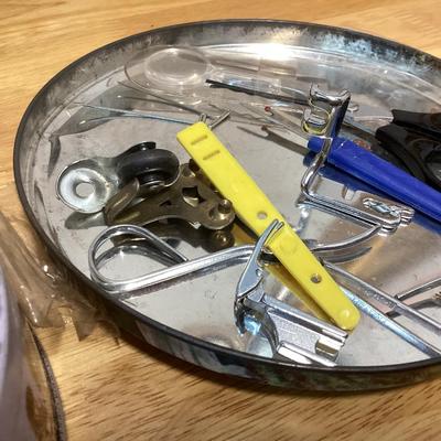 tin full of buttons and a few misc. sewing items