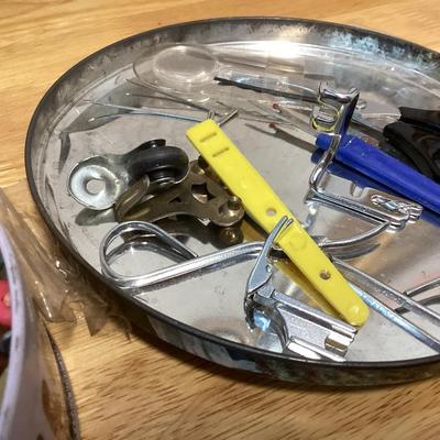 tin full of buttons and a few misc. sewing items