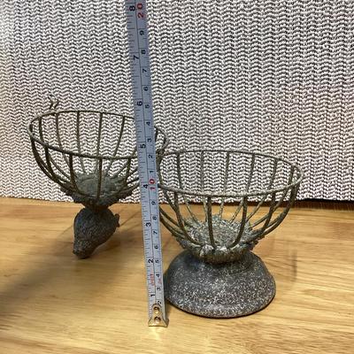 small gray distressed metal decorative bird cage cloche with a bird finial