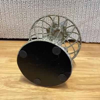 small gray distressed metal decorative bird cage cloche with a bird finial