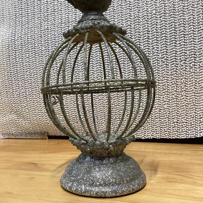 small gray distressed metal decorative bird cage cloche with a bird finial