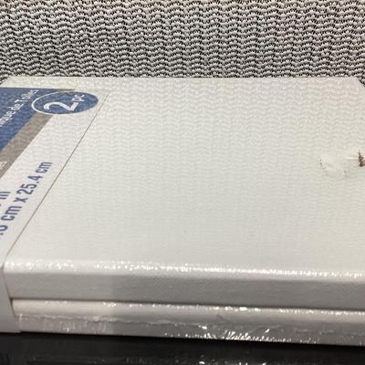 bundle of various sizes of stretched canvases new in packages