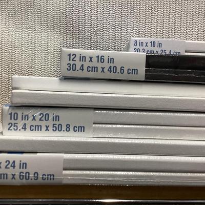 bundle of various sizes of stretched canvases new in packages