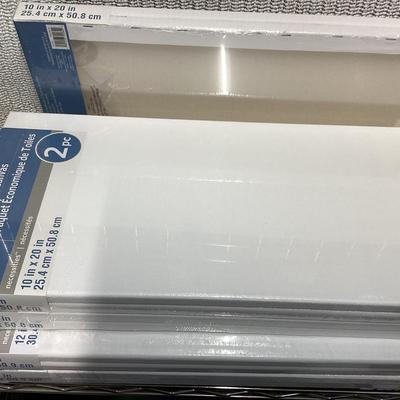 bundle of various sizes of stretched canvases new in packages