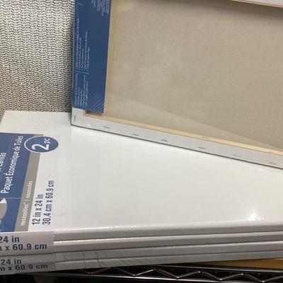 bundle of various sizes of stretched canvases new in packages