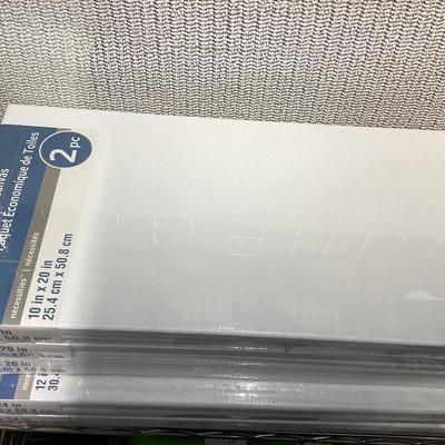 bundle of various sizes of stretched canvases new in packages