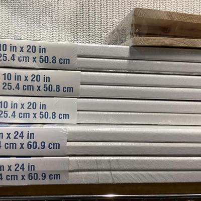 bundle of various sizes of stretched canvases new in packages