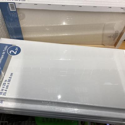 bundle of various sizes of stretched canvases new in packages