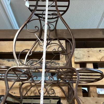 Metal plant stand- you're looking up at it in this photo
