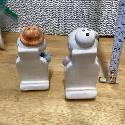 Vintage grandma and grandpa couple seated in rocking chairs salt and pepper shakers