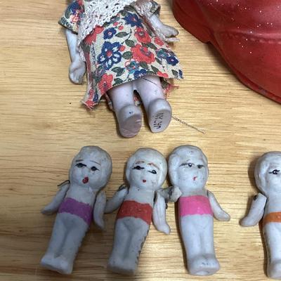 Porcelain shoe and dolls. Old woman and all her children