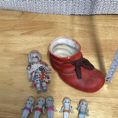 Porcelain shoe and dolls. Old woman and all her children