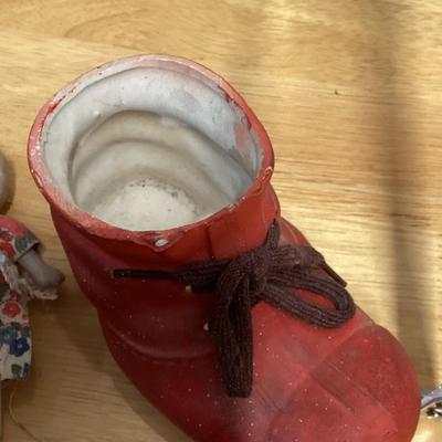 Porcelain shoe and dolls. Old woman and all her children