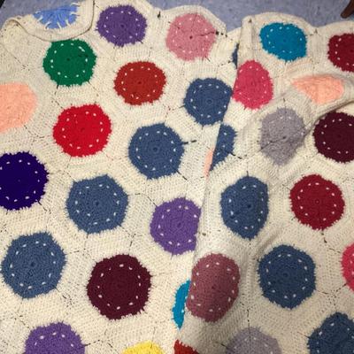vintage multicolor hand crocheted Afghan blanket made of hexagon sunburst or granny squares