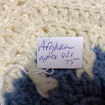 vintage multicolor hand crocheted Afghan blanket made of hexagon sunburst or granny squares