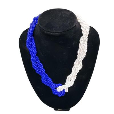 Sale Photo Thumbnail #38: Les Bernard Blue and White Beaded Torsade Necklace
See Photo for size