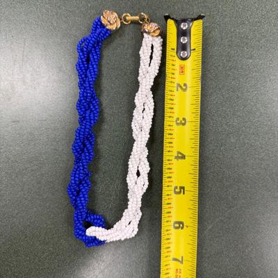 Sale Photo Thumbnail #40: Les Bernard Blue and White Beaded Torsade Necklace
See Photo for size