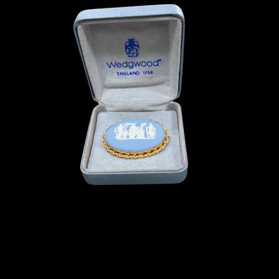 Sale Photo Thumbnail #67: Vintage Wedgwood Jasperware Cameo Brooch in Pale Blue and White Color with Raised Relief Scene Set in a gold tone frame.  Includes Box