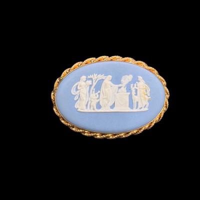 Sale Photo Thumbnail #66: Vintage Wedgwood Jasperware Cameo Brooch in Pale Blue and White Color with Raised Relief Scene Set in a gold tone frame.  Includes Box