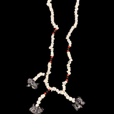 Sale Photo Thumbnail #74: Vintage Hand Carved Foo Dog Totem Necklace featuring white chip style beads, red beads and black beads
See Photo for size