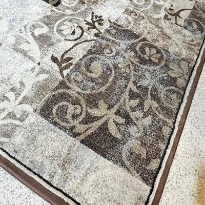 Lot 16 Brown scroll work rug