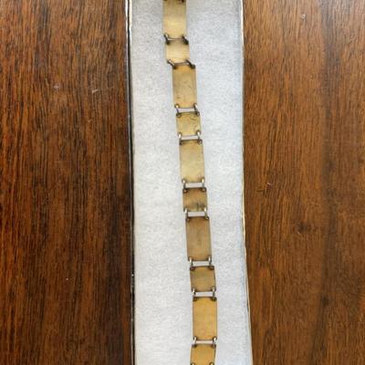 Sale Photo Thumbnail #243: Vintage, guilloche red and black enamel panel bracelet. 
7 inches long closed.