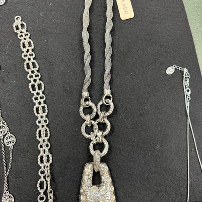 Sale Photo Thumbnail #232: Set of 4 Silver Toned Necklaces