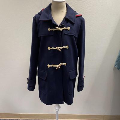 Sale Photo Thumbnail #258: Wool, Made in Italy
2 flap pockets, zipper and toggle closure, 1 interior pocket 
Hood
Dark Blue with red accent
Striped black and white lining
Comes with its own garment bag 
estimate size Medium
Excellent condition,  1 previous owner