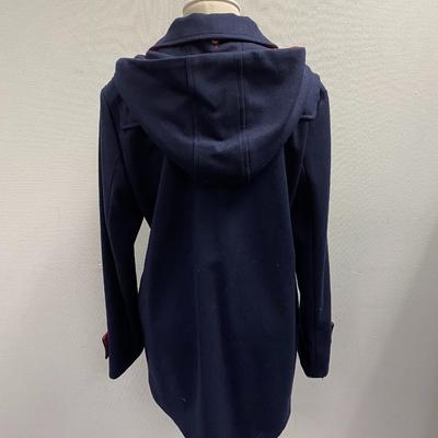 Sale Photo Thumbnail #257: Wool, Made in Italy
2 flap pockets, zipper and toggle closure, 1 interior pocket 
Hood
Dark Blue with red accent
Striped black and white lining
Comes with its own garment bag 
estimate size Medium
Excellent condition,  1 previous owner