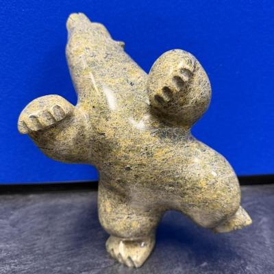 Sale Photo Thumbnail #268: This is a very special piece, created by Oqituqshaa.  It is a celebrated and iconic subject in Inuit art, representing harmony 
with  nature or a spiritual transformation.  The pose, with the head held high and limbs akimbo, captures a sense of movement, 