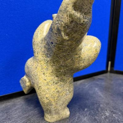 Sale Photo Thumbnail #267: This is a very special piece, created by Oqituqshaa.  It is a celebrated and iconic subject in Inuit art, representing harmony 
with  nature or a spiritual transformation.  The pose, with the head held high and limbs akimbo, captures a sense of movement, 