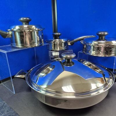 Sale Photo Thumbnail #287: Lifetime has been bought out by West Bend
Included are 3/4 quart , 2 quart saucepans with lids
 8" covered fry pan
15" covered wok style pan
All are in NEW condition