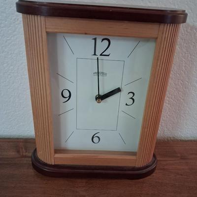 SPRINGFIELD BATTERY OPERATED CLOCK AND A SIDE CABINET