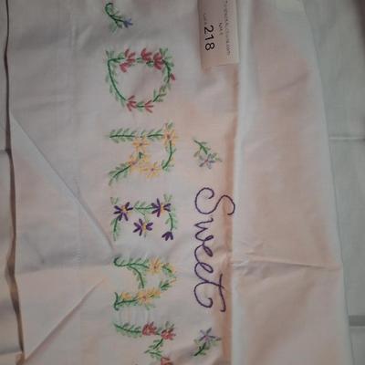  pair of stamped embroidery pillowcases with a "Sweet Dreams" floral design. 