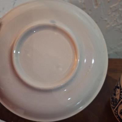 vintage Delft Blue ceramic teacup and saucer set, featuring a classic Dutch windmill and floral design