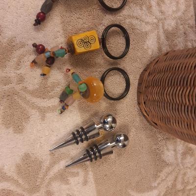 Kitchen utensils in woven basket, pier 1 napkin rings and 2 wine stoppers