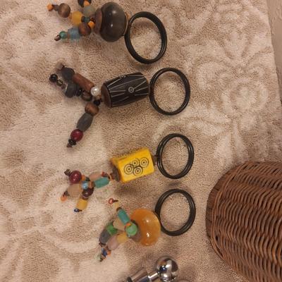 Kitchen utensils in woven basket, pier 1 napkin rings and 2 wine stoppers