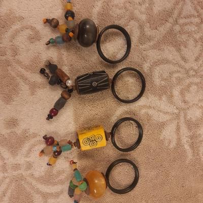 Kitchen utensils in woven basket, pier 1 napkin rings and 2 wine stoppers