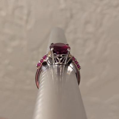 Sterling silver 925 ring size 8 with a large red stone and smaller accent stones
