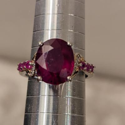 Sterling silver 925 ring size 8 with a large red stone and smaller accent stones