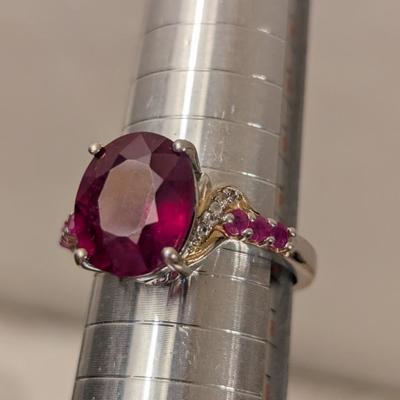 Sterling silver 925 ring size 8 with a large red stone and smaller accent stones
