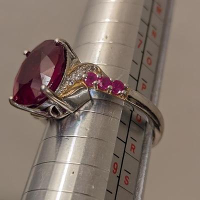 Sterling silver 925 ring size 8 with a large red stone and smaller accent stones