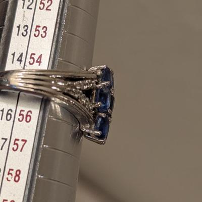 Sterling silver ring size 7 with blue stones maybe blue kyanite? And clear stone accents