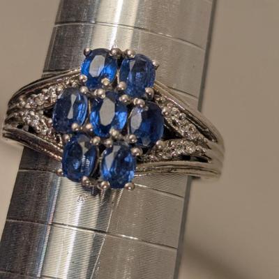 Sterling silver ring size 7 with blue stones maybe blue kyanite? And clear stone accents