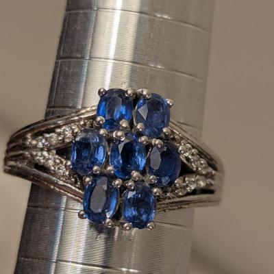 Sterling silver ring size 7 with blue stones maybe blue kyanite? And clear stone accents