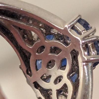 Sterling silver ring size 7 with blue stones maybe blue kyanite? And clear stone accents