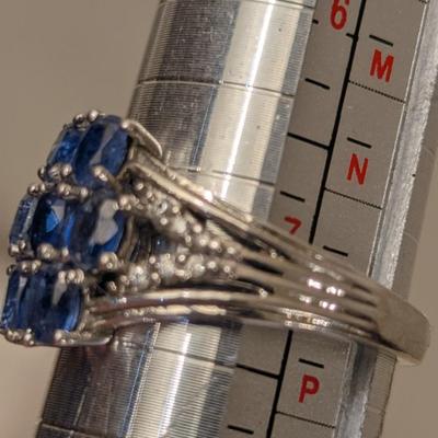 Sterling silver ring size 7 with blue stones maybe blue kyanite? And clear stone accents